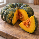 Yuxi Jiang Bing Gua squash - cut wedge showing thick orange flesh and seed cavity - Chinese heirloom moschata