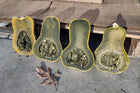 Four Guatemalan Green Ayote halves on concrete, pale green flesh and seed cavities showing