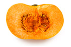 New England Cheddar F1 pumpkin half on a white background, thick deep orange flesh around a small seed cavity