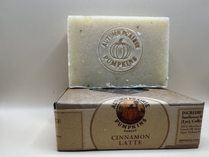 Cinnamon Latte soap bar propped on its kraft box at an angle, ingredient panel visible - 4.5 oz cold process
