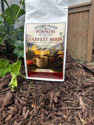 Harvest Moon Coffee - balanced medium roast - 12 oz bag on garden mulch
